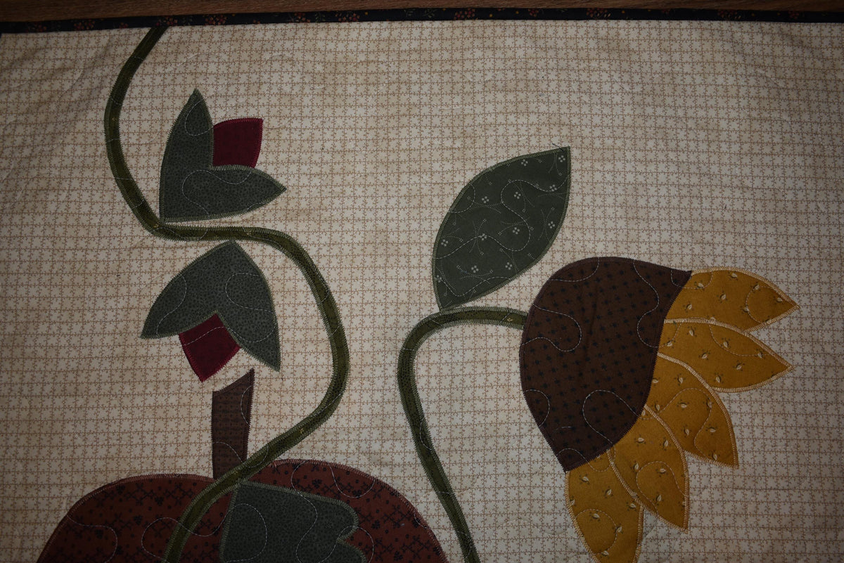 Quilt:  A Quilt measuring 30" high by 26.5" wide    Featuring Two Pumpkins, a Sunflower and other Flowers